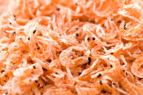 A pile of pink dried krill for feeding fish