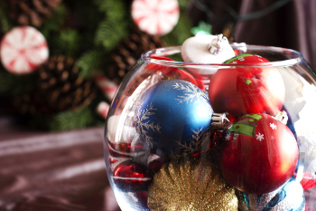 Photo of Christmas tree ornaments in a fish bowl.