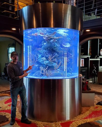 Our owner, Cory, with a custom-built aquarium